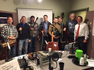 Members of Helicon and Charm City Junction join Tom Hall in WYPR’s Studio A before their 2016 Winter Solstice Concert: (l-r) Ken Kolodner, Chris Norman, Brad Kolodner, Patrick McAvinue, Sean McComiskey, Alex Lacquement, Robin Bullock, Tom Hall.